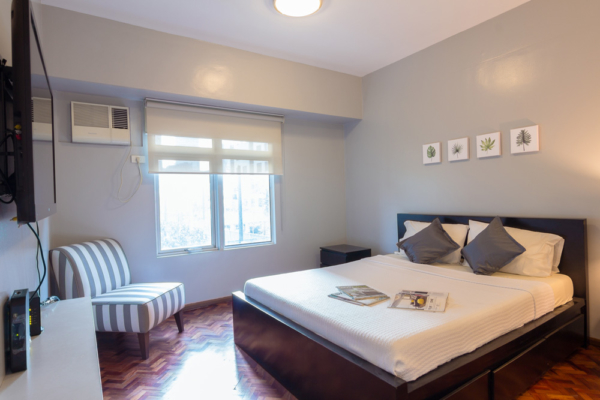 Almond at Two Serendra apartment - bedroom one