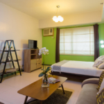 The Infinity studio apartments - bed and tv