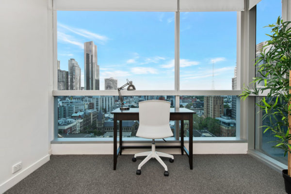 QV1 apartment - study desk with view of Melbourne