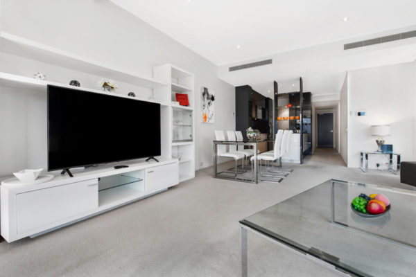 Eureka Tower apartment 2208 - living room with large tv