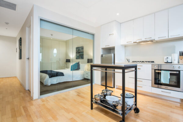 Atlantis - Melbourne apartment - kitchen and bedroom