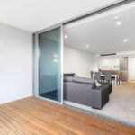 Queens Riverside - QII apartment 107 - balcony and living room