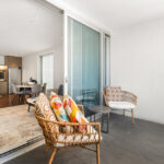QT Apartments, Perth - apartment 1507, balcony and living room