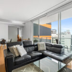 Condor Towers, Perth. Apartment 107 living room and balcony with view