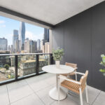 LIV Aston apartment, Melbourne, balcony with view of Melbourne CBD