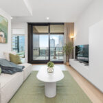 LIV Aston apartment, Melbourne, living room and balcony